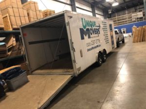 Empty Unique Movers trailer ready for a move