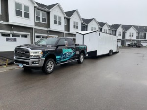 Unique Movers truck and trailer for an apartment move